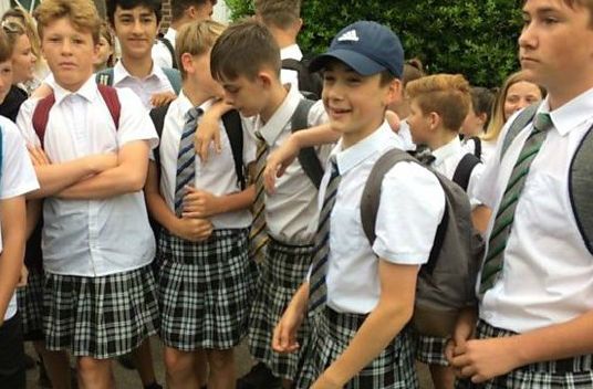 Boys protest against uniform ban and wear skirts to school