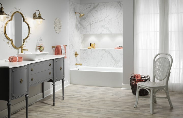 a bathroom with a tub and sink
