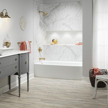 a bathroom with a tub and sink