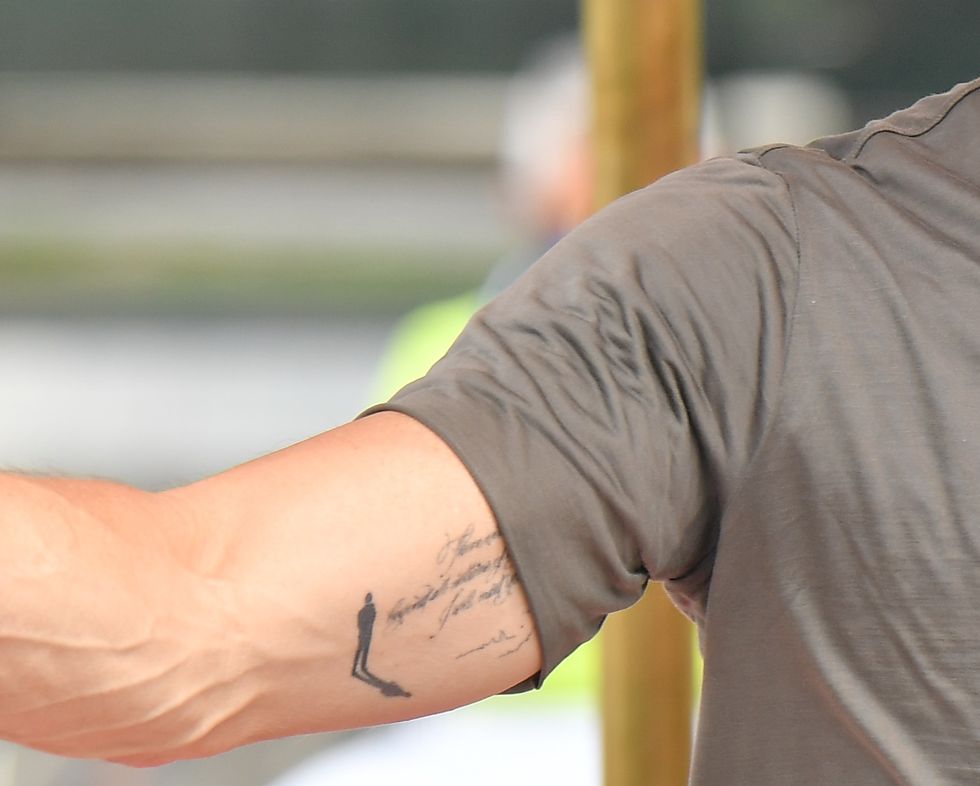 What Is Brad Pitt's New Arm Tattoo? The Meaning of His New Ink.