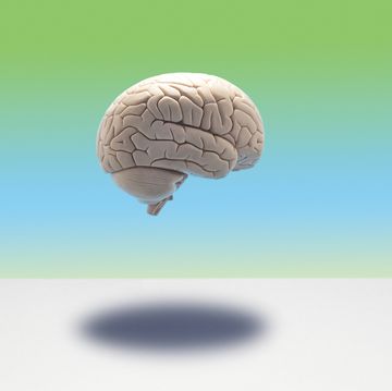 brain floating against a blue and green background