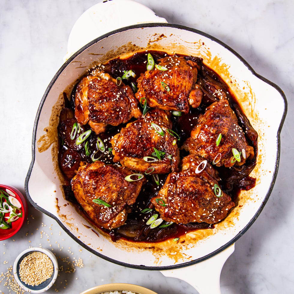 braised chicken thighs in a sauce with green onions