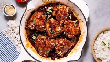 braised chicken thighs in a sauce with green onions