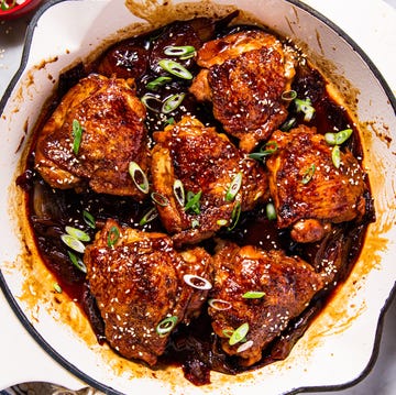 Braised Chicken Thighs braised chicken thighs in a sauce with green onions