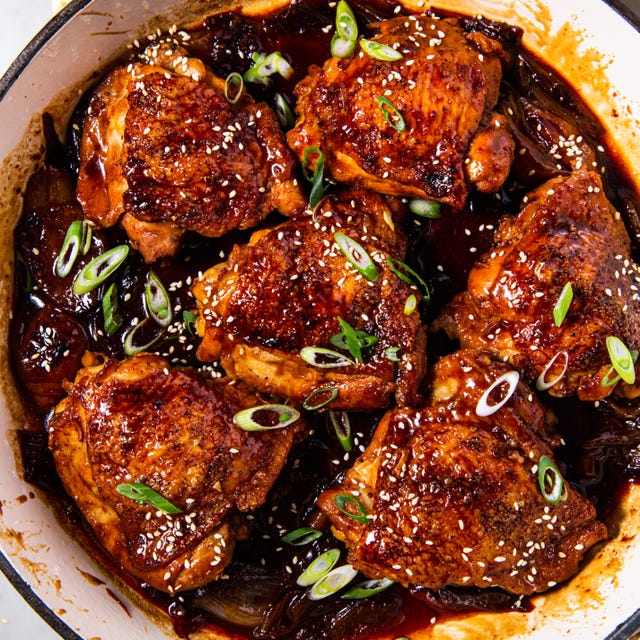 braised chicken thighs in a sauce with green onions