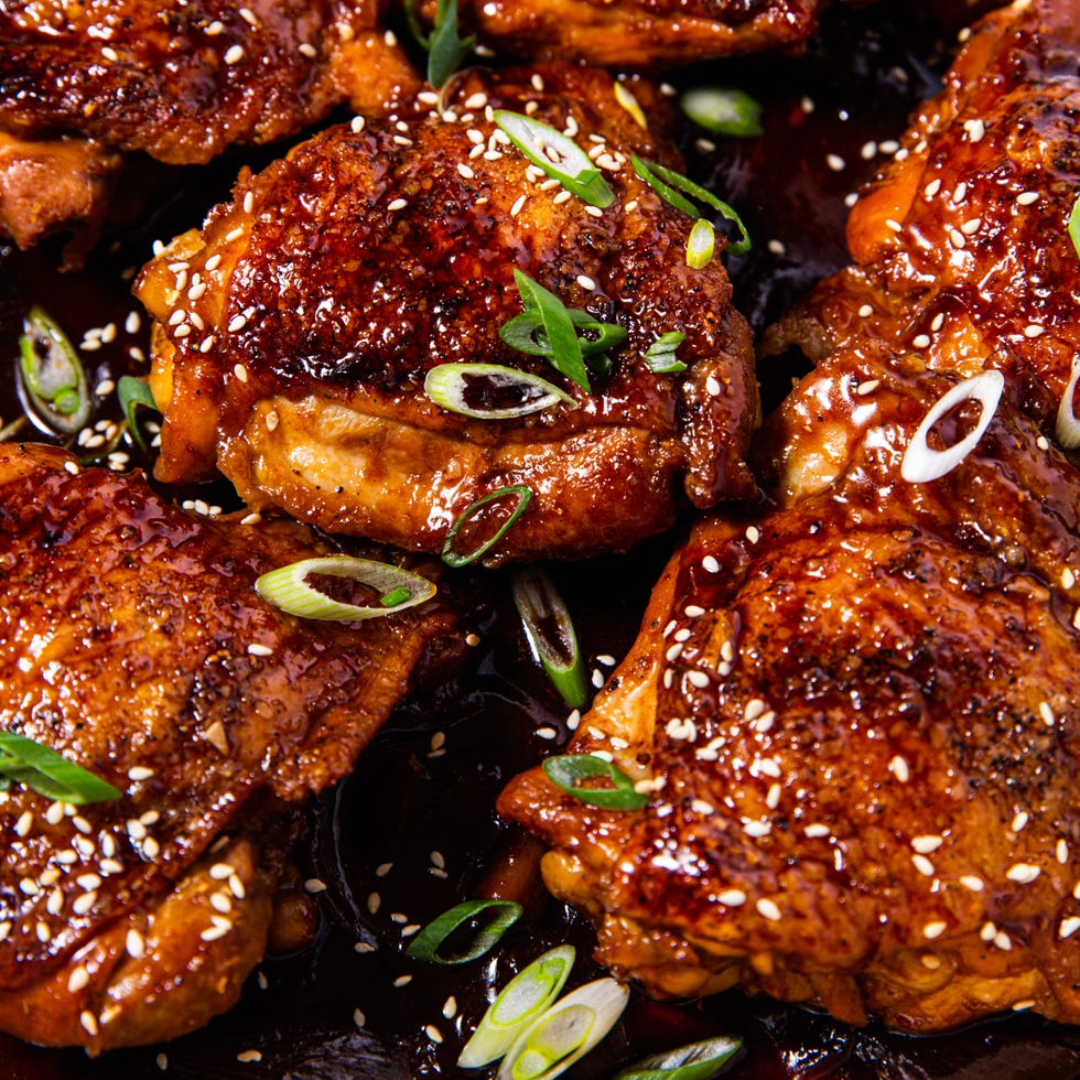 braised chicken thighs in a sauce with green onions