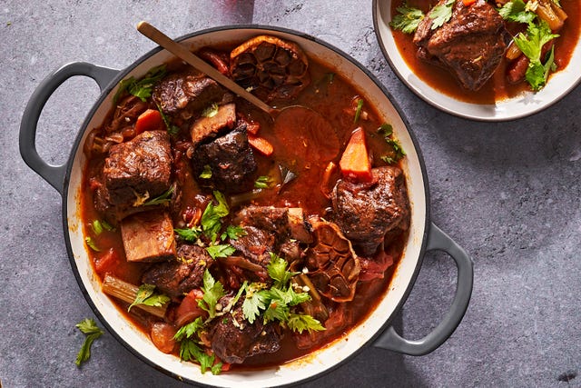 braised short ribs with 40 cloves of garlic in a dutch oven