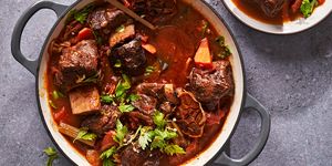 braised short ribs with 40 cloves of garlic in a dutch oven