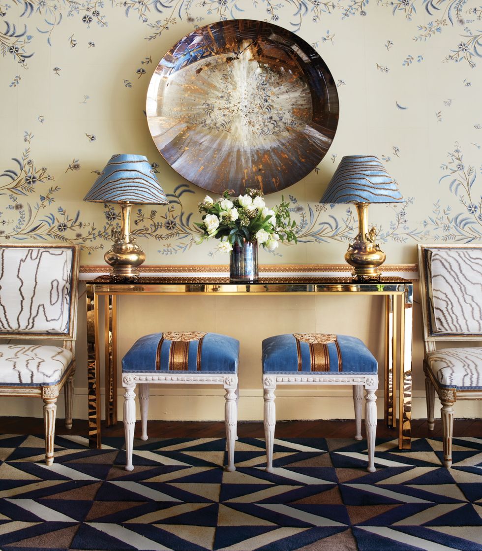 Console with geometric carpet and floral wallcovering