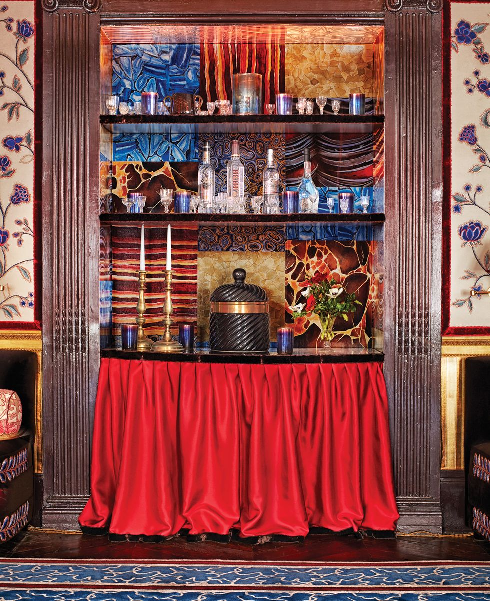 Bar with red table skirt and mineral wallpaper