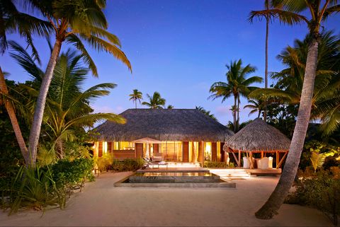 Resort, Property, Tropics, Palm tree, Tree, Vacation, Attalea speciosa, House, Building, Real estate, 