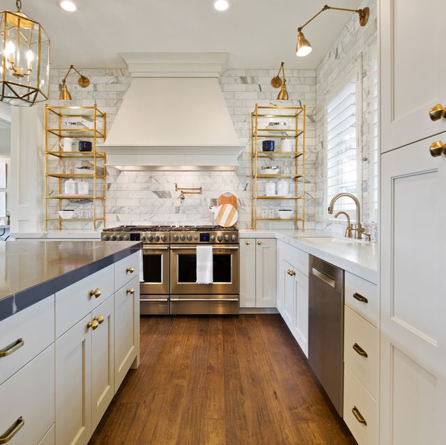 brass fixtures accompany stainless steel appliances in showcase kitchen