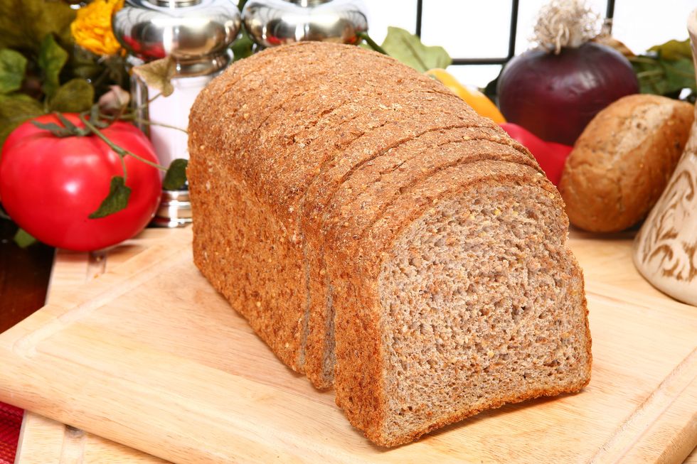 ezekiel or sprouted wheat  whole grain flourless bread in kitchen or restaurant