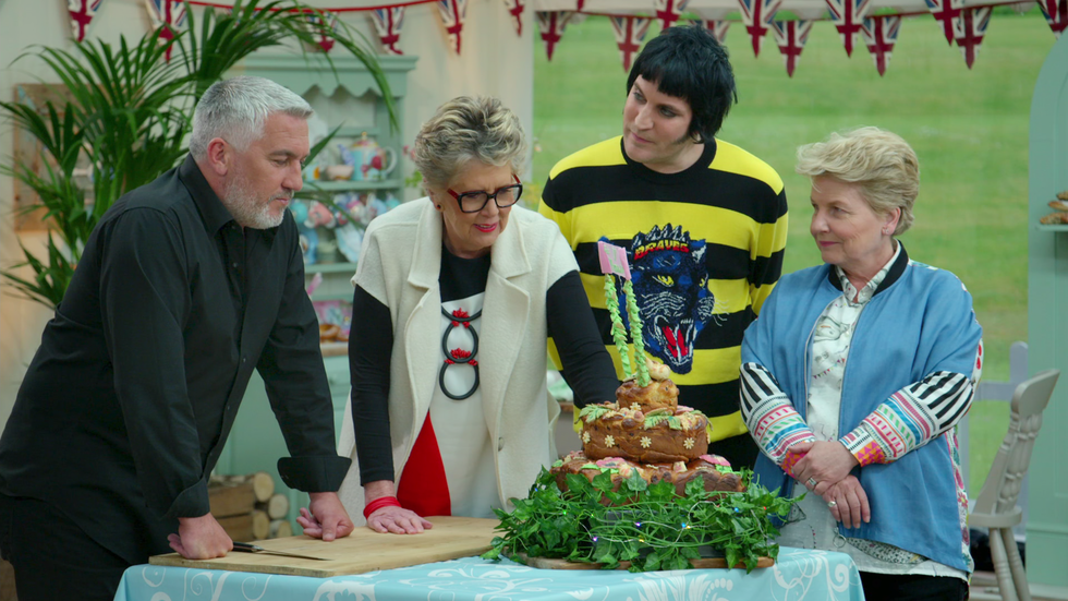 prue leith judging a contestent's cake on the great british baking show