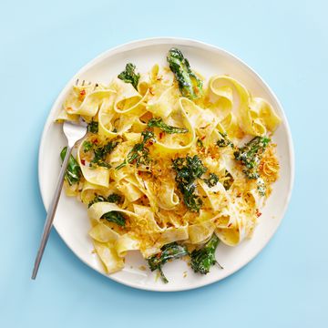 a plate of pasta with greens and breadcrumbs