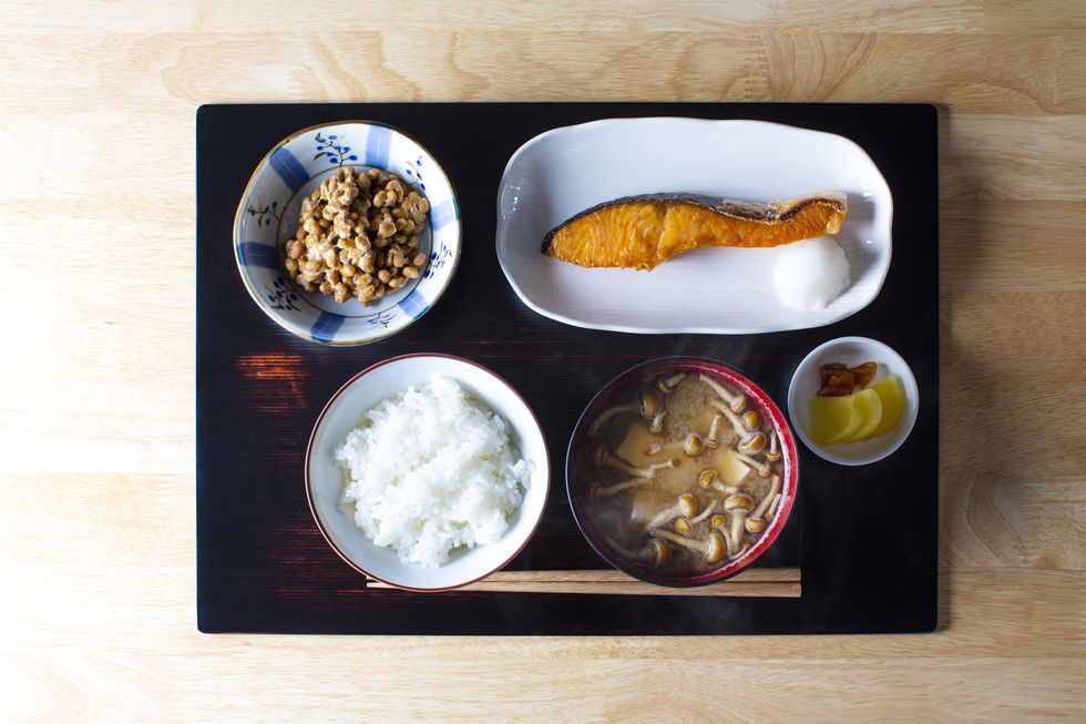breakfast and lunch with rice and side dishes unique to japan placed on the tray we eat with cooked rice as our staple food