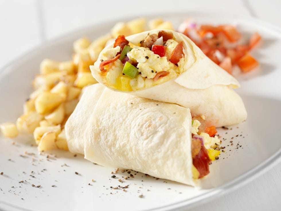 breakfast burrito with hash brown potatoes and salsa