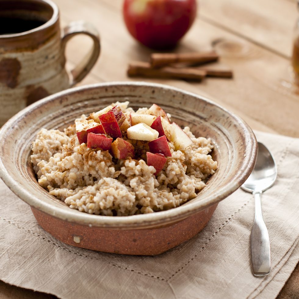 breakfast made of oatmeal with apples, honey and cinnamon