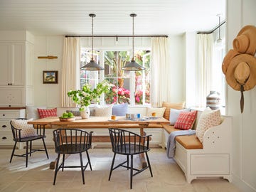 breakfast nook with built in bench banquette and black windsor chairs