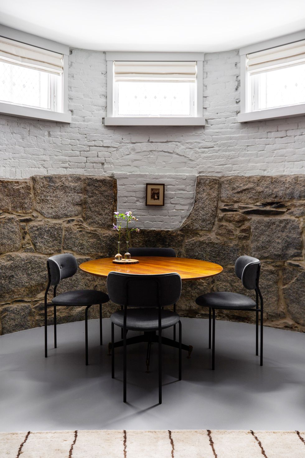 small dining nook with stone walls