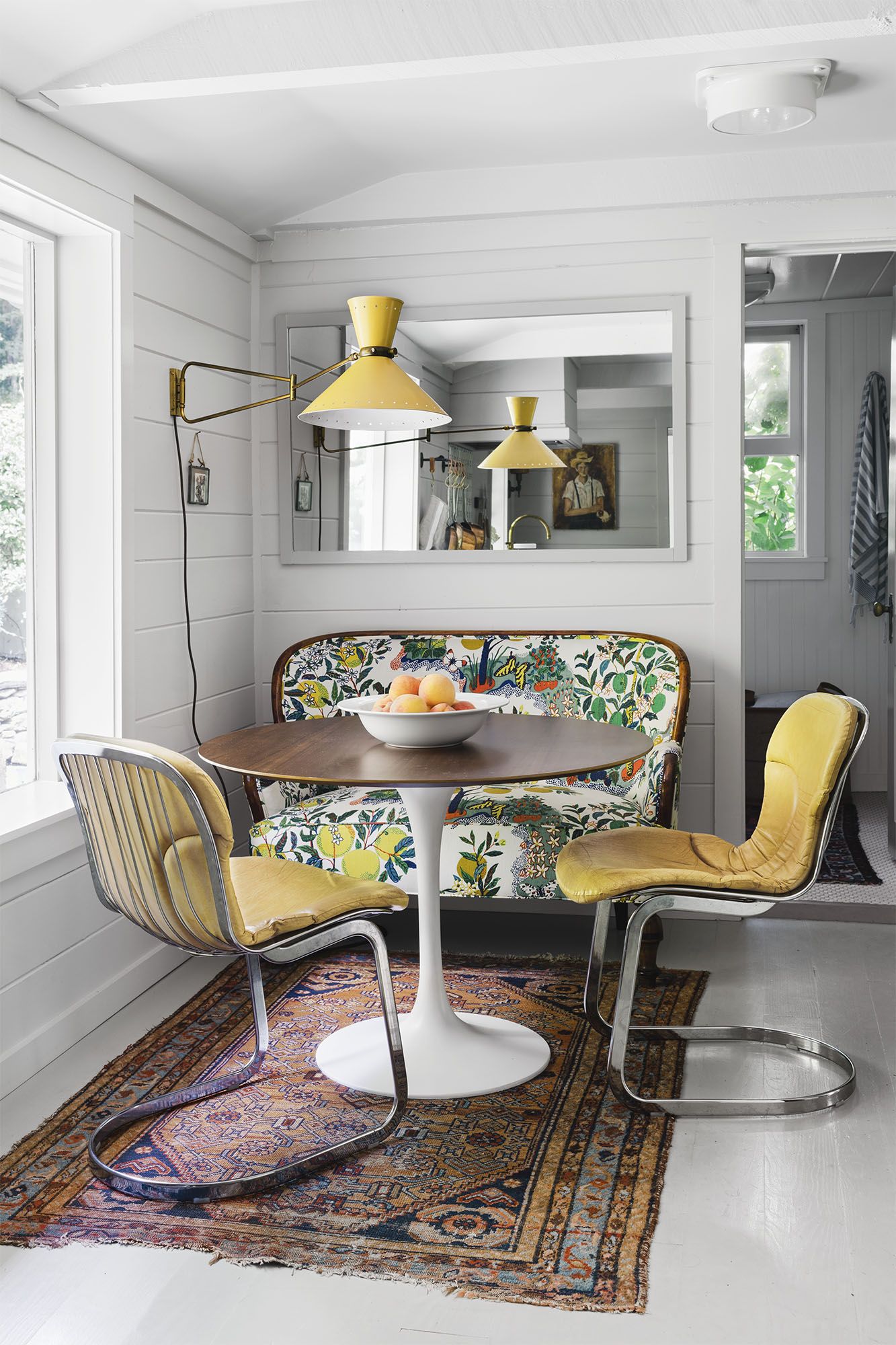 https://hips.hearstapps.com/hmg-prod/images/breakfast-nook-ideas-floral-bench-yellow-chairs-1643130714.jpg