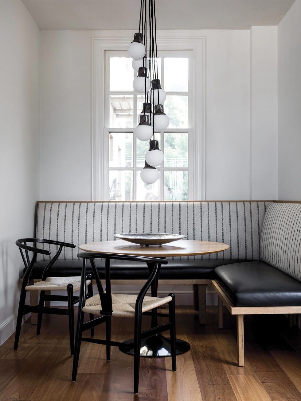 Room, Furniture, Interior design, Table, Floor, Wood flooring, Lighting, Dining room, Ceiling, Building, 