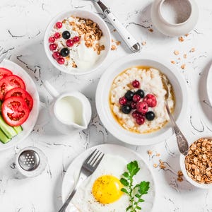 Breakfast - oatmeal, fried egg, cottage cheese, berries, granola