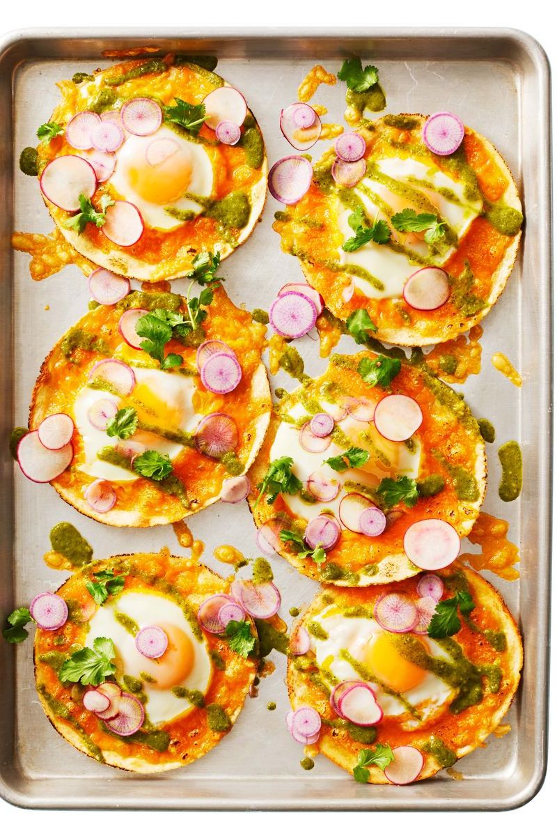 breakfast tacos on a sheet pan with toppings