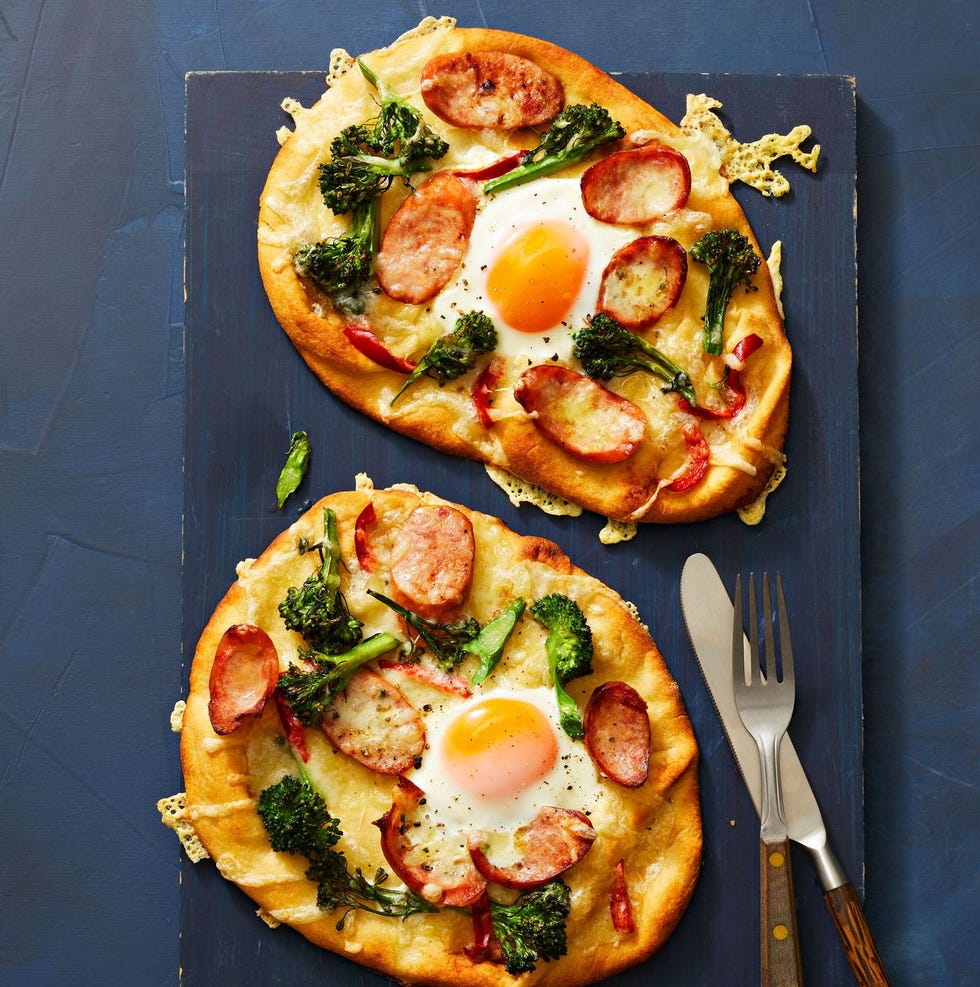 naan bread with egg and sausage on top