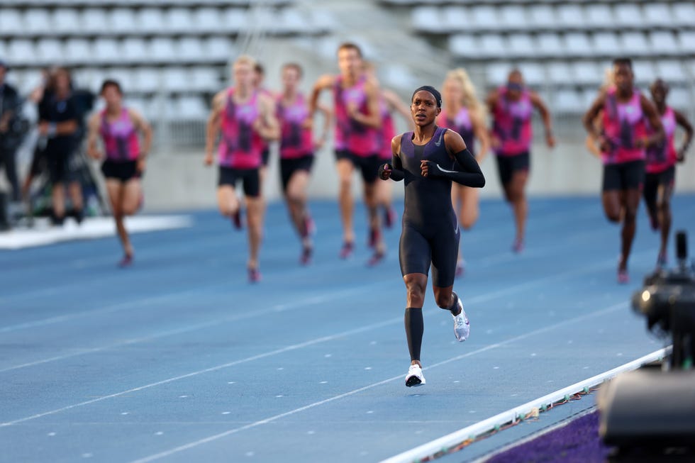 athletes competing in a race on a track