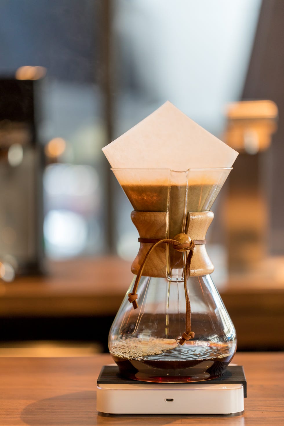 Brewign third wave coffee with chemex glass and drip kettle for pure flavor  in good design on wooden table Stock Photo - Alamy