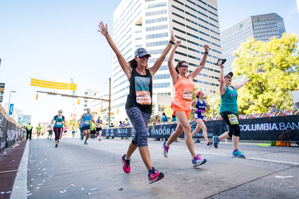participants celebrating at a marathon finish line baltimore marathon