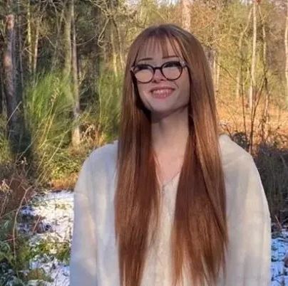 brianna ghey, a 16 year old trans teenager, seen smiling in a wood she has long strawberry blonde hair and glasses