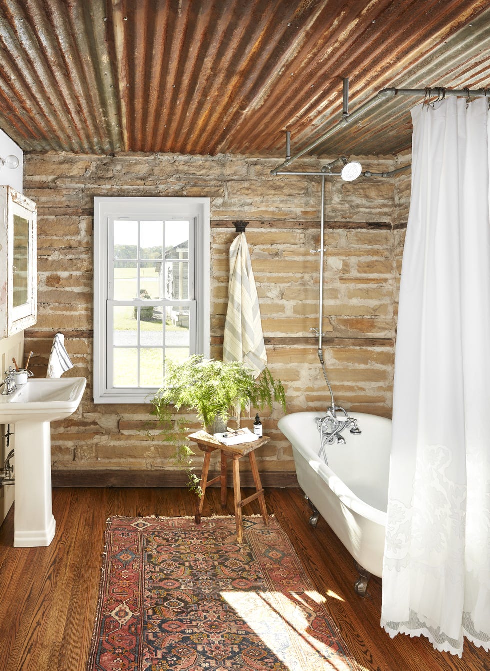 brick bathroom with persian rug