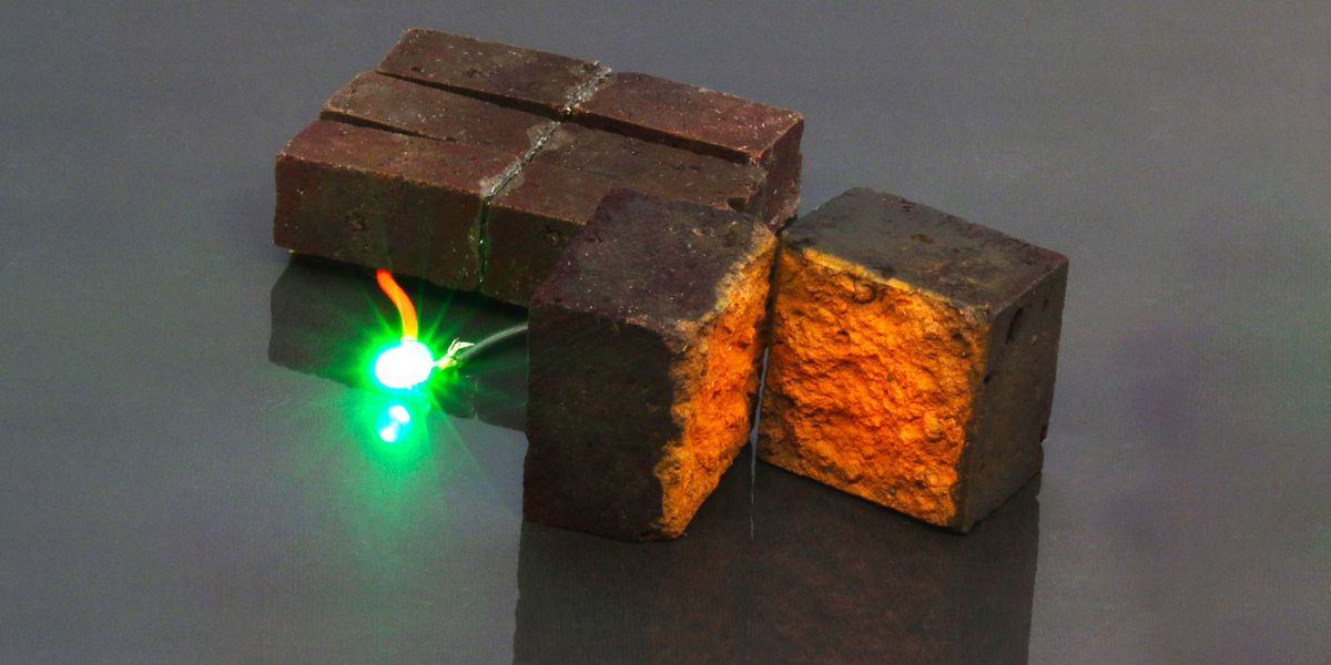 red brick device developed by chemists at washington university in st louis lights up a green light emitting diode