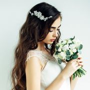 Petal, Hairstyle, Photograph, Bridal accessory, Flower, Hair accessory, Bouquet, Headpiece, Bridal clothing, Dress, 
