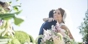 A bride and groom embrace on their wedding day