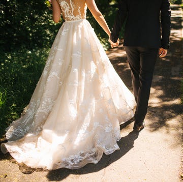 bride and groom walking on pavements