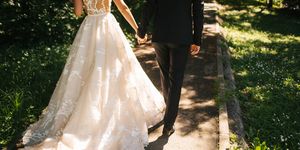 bride and groom walking on pavements