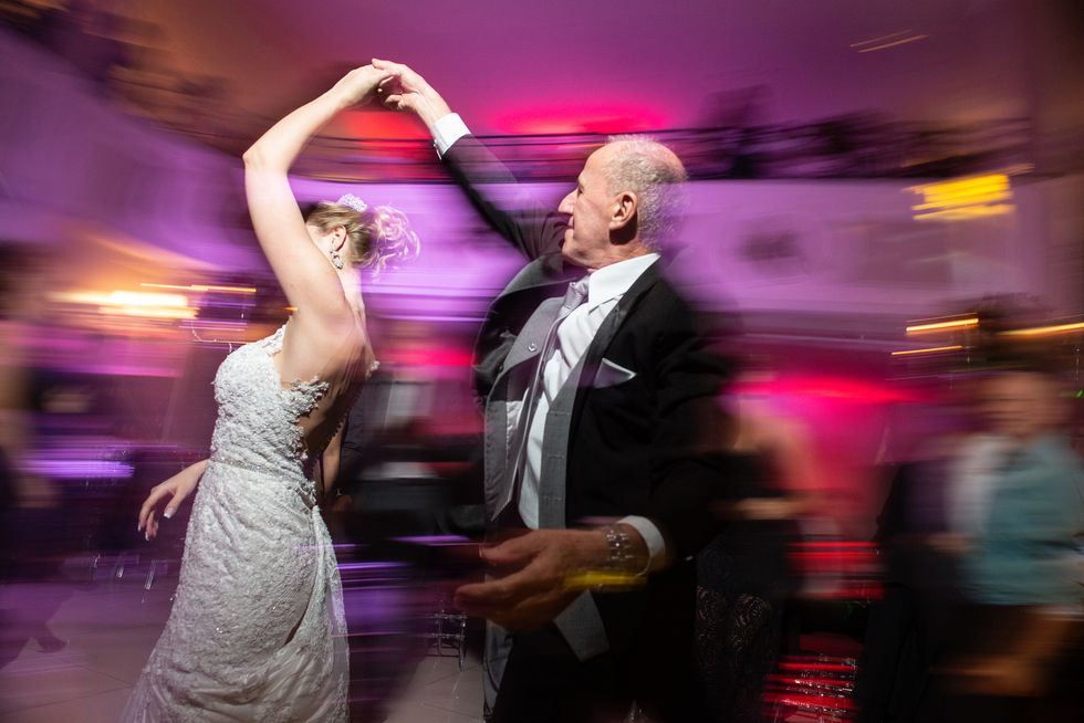 bride dancing with her father at wedding