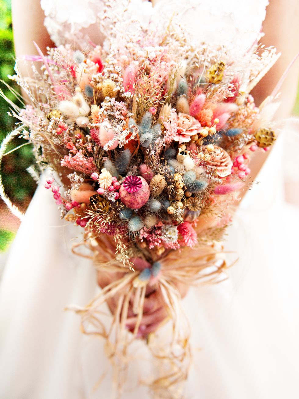 Bride holding her bouquet of dried flowers