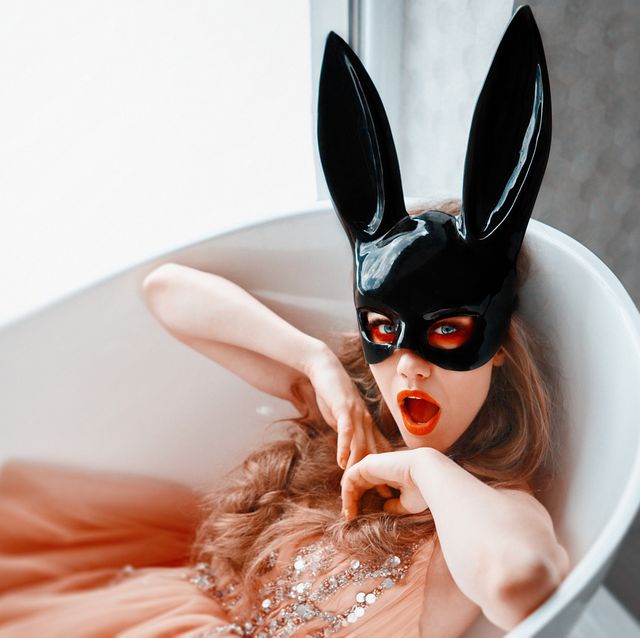 bride wearing bunny mask in the bathtub