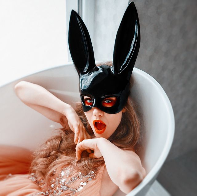 bride wearing bunny mask in the bathtub