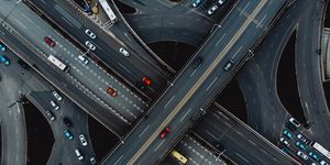 overhead shot of highway with cars driving on them