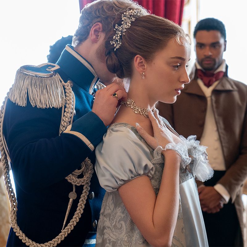 prince friedrich of prussia putting necklace on daphne bridgertons neck with duke of hastings watching