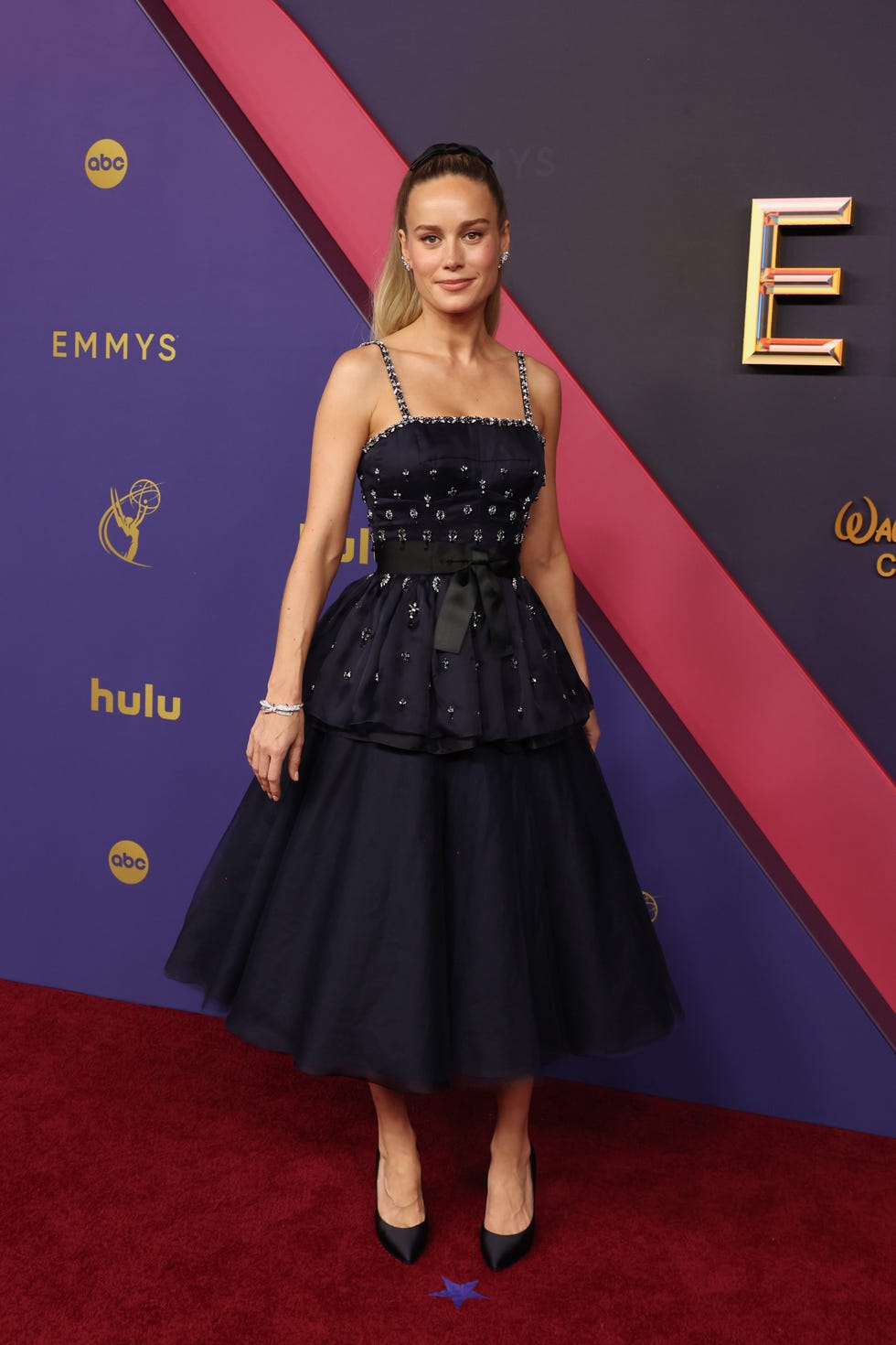 brie larson at the 2024 emmys in a black chanel dress