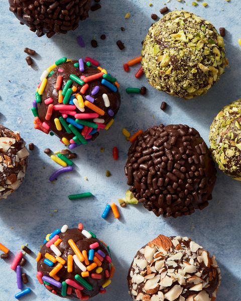 brigadeiros covered in chocolate and rainbow sprinkles, pistachios, and almonds