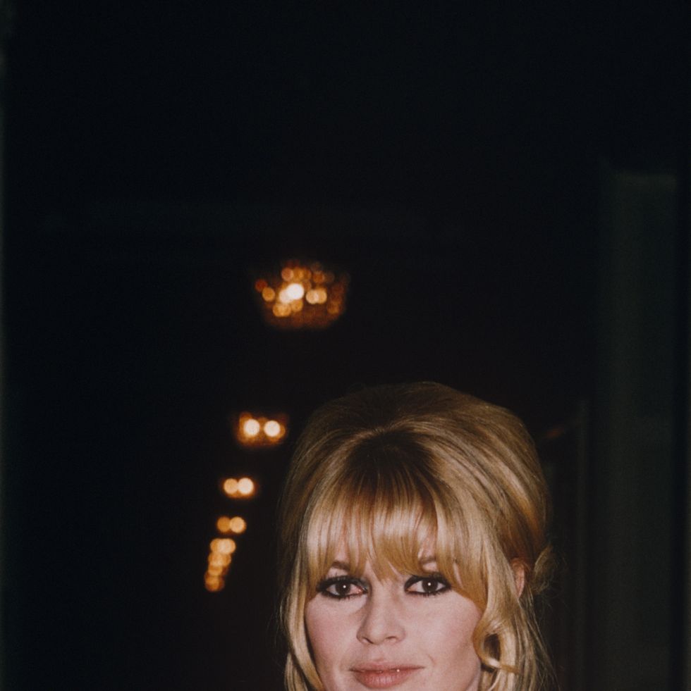 brigitte bardot wearing a white evening dress at the plaza hotel; circa 1970; new york. (photo by art zelin/getty images)