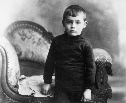 cary grant at age four stands by chair