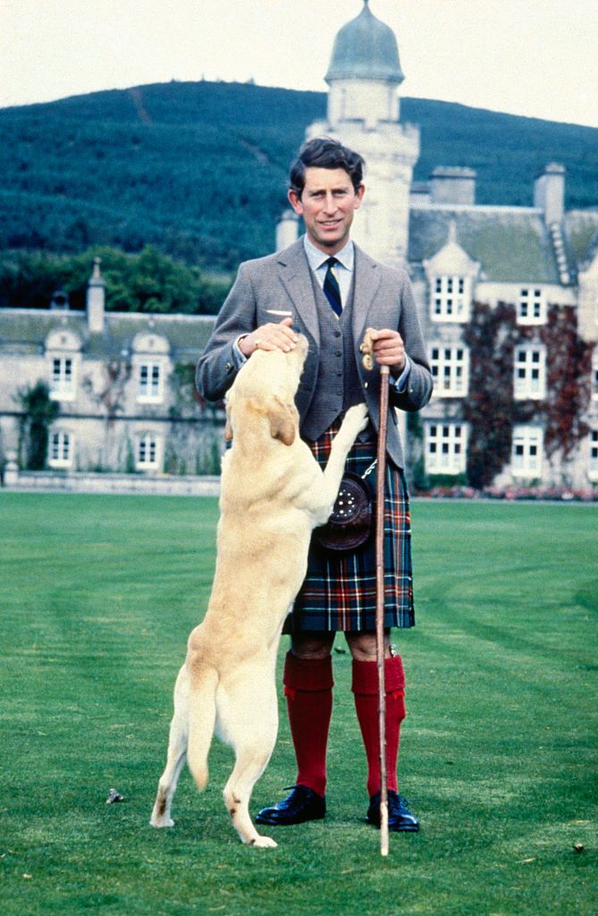 prince charles posing with dog